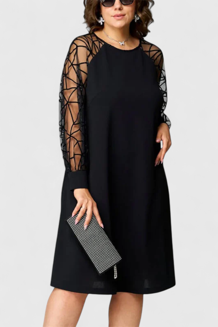 Vestido negro con mangas de malla